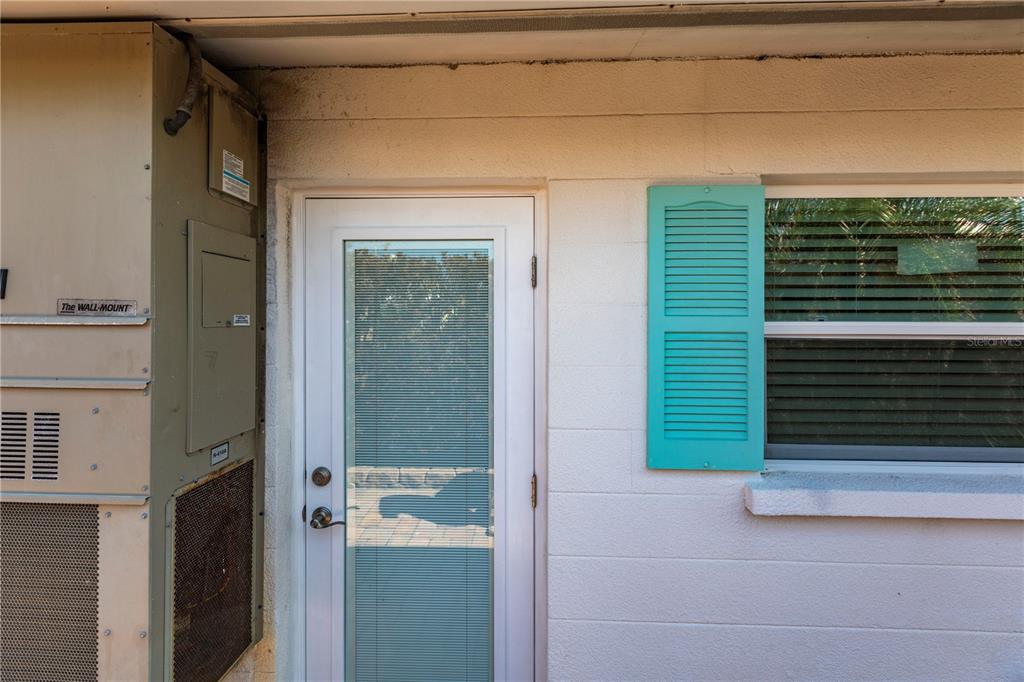 a view of a house with a door and a window