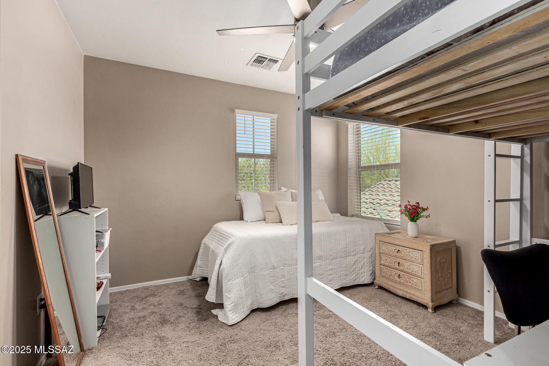 9528 Desert Fauna Loop Tucson, AZ 85747 - Photo 29 of 46 a bedroom with bed and a window