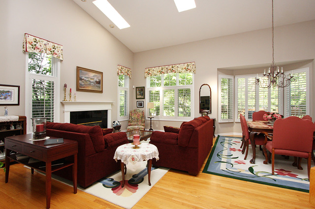 1760 Park Ridge Point, Unit 1760 Park Ridge, IL 60068 - Photo 4 of 15 a living room with furniture a fireplace and large windows