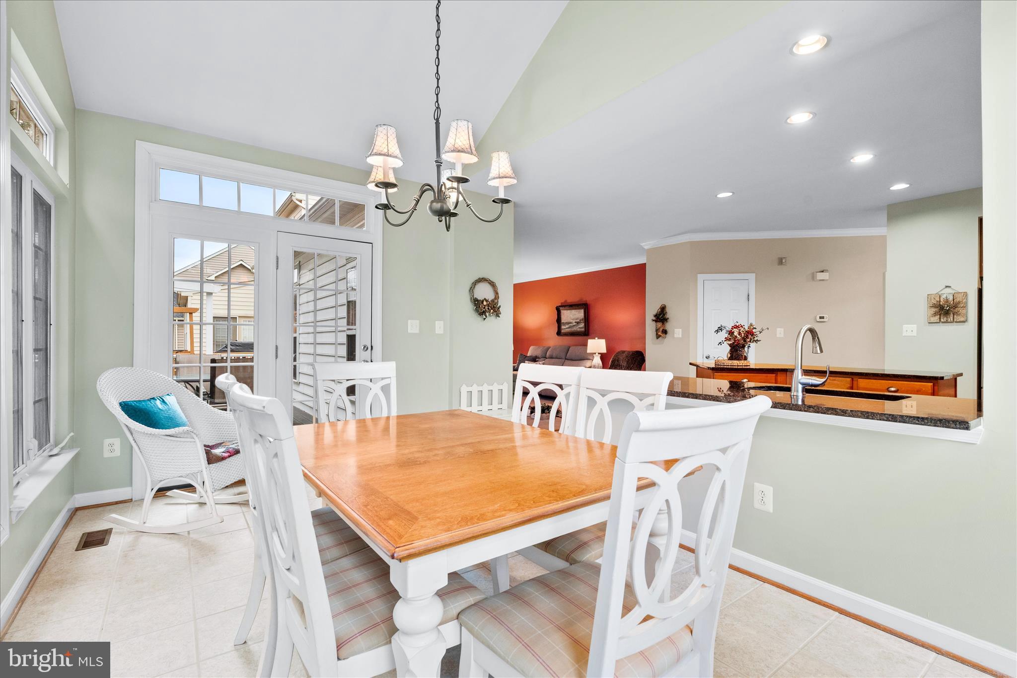 9054 Seward Street Frederick, MD 21704 - Photo 15 of 41 a view of a dining room with furniture and a chandelier