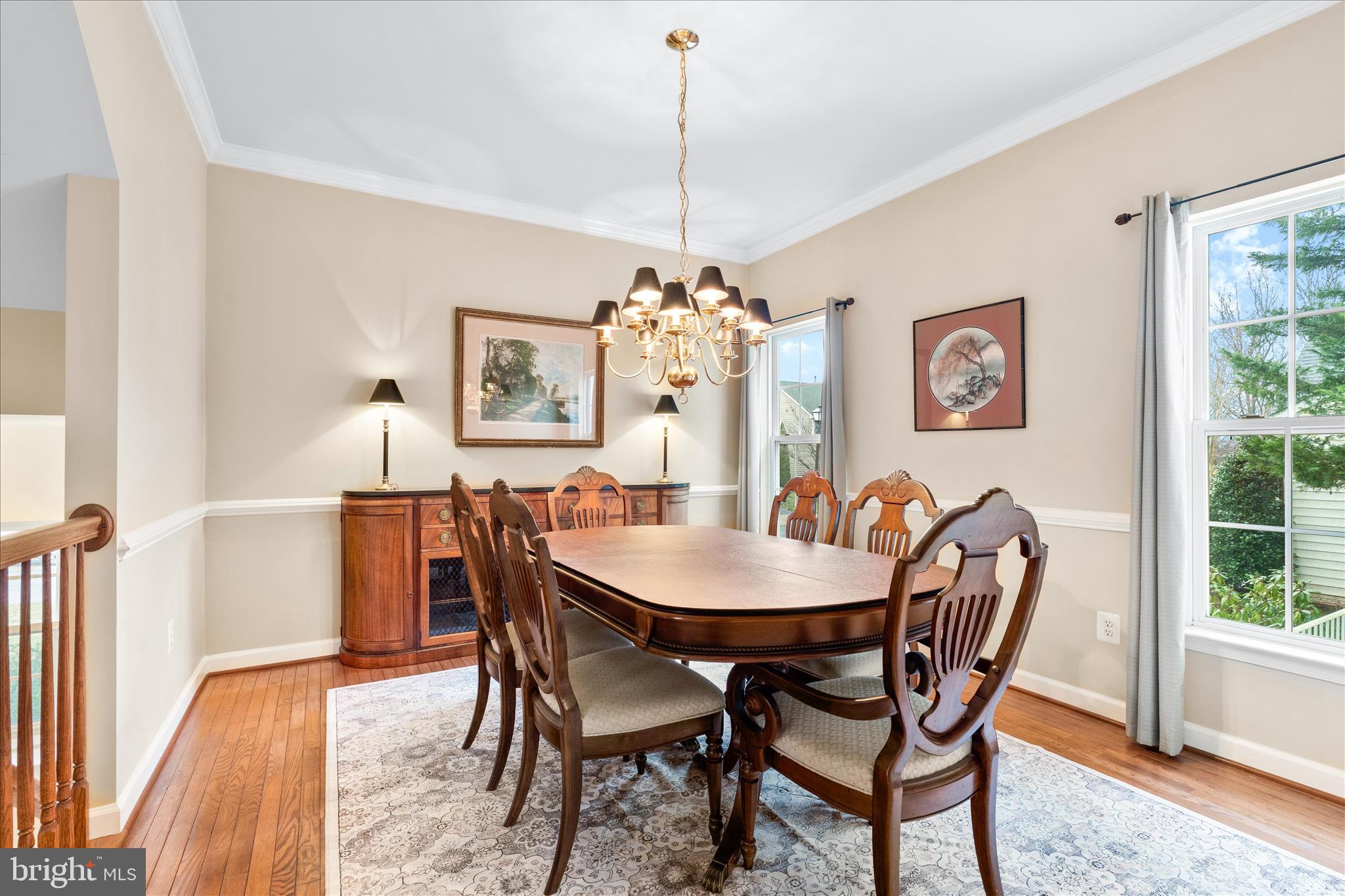 9054 Seward Street Frederick, MD 21704 - Photo 16 of 41 a dining room with furniture a chandelier and wooden floor
