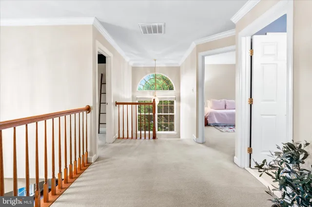 a view of a room that has a bed and a large window