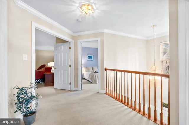 a view of a hallway view with staircase