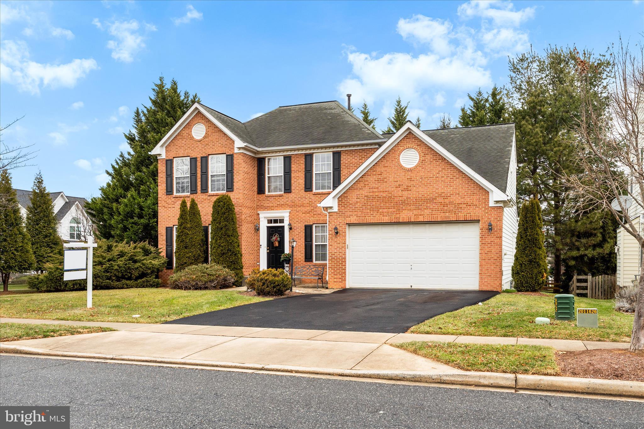 9054 Seward Street Frederick, MD 21704 - Photo 2 of 41 a front view of a house with a yard and garage