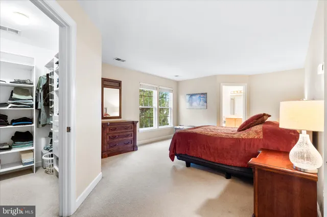 a bed room with a bed and a window