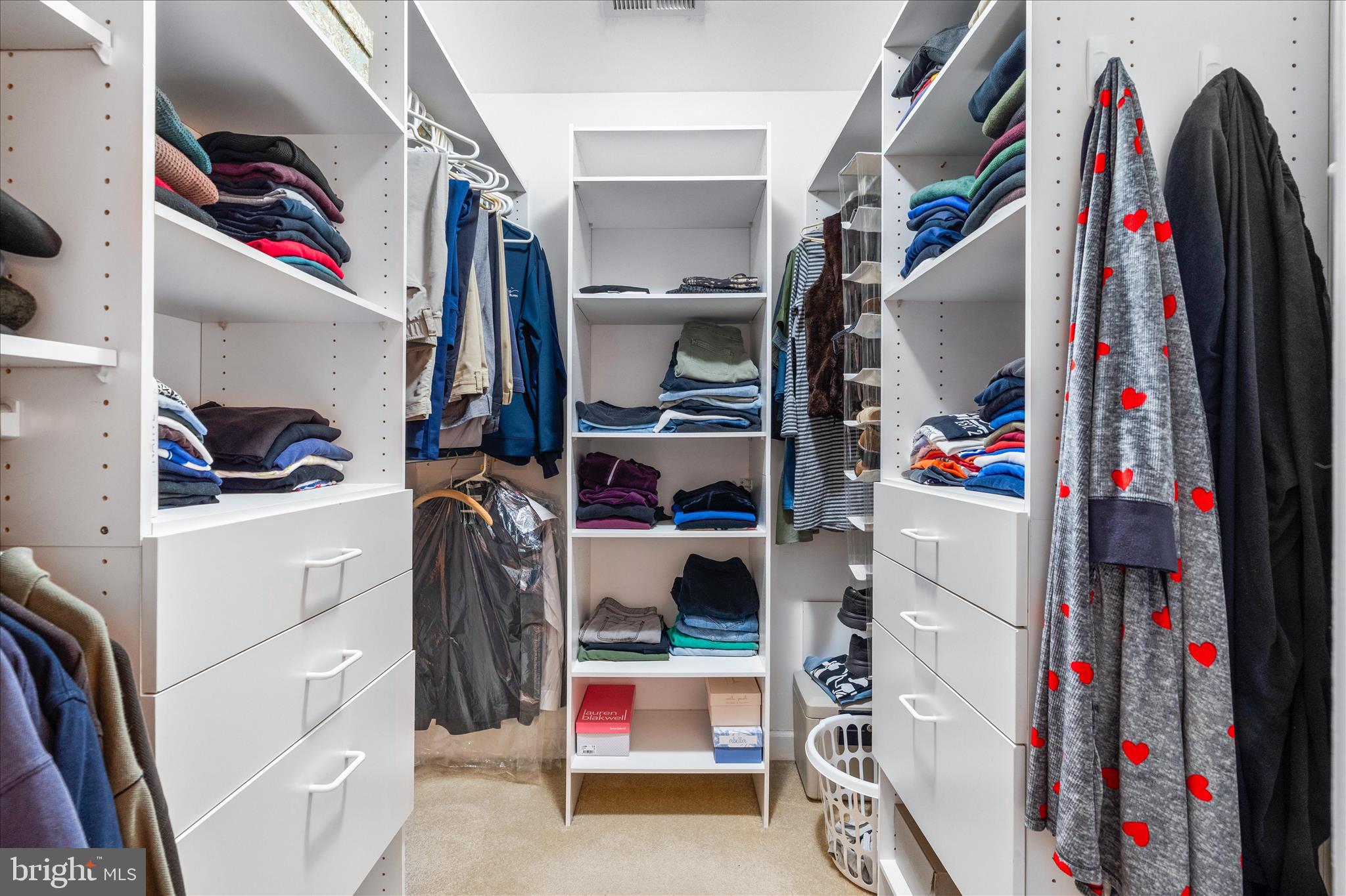 9054 Seward Street Frederick, MD 21704 - Photo 22 of 41 a view of walk in closet with clothes and shoes