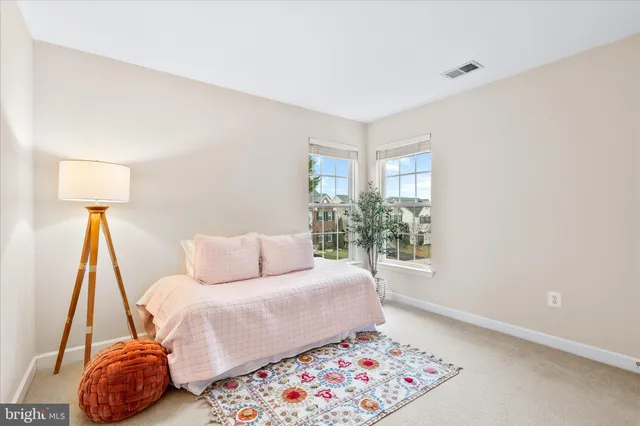 a bed room with a bed and a window