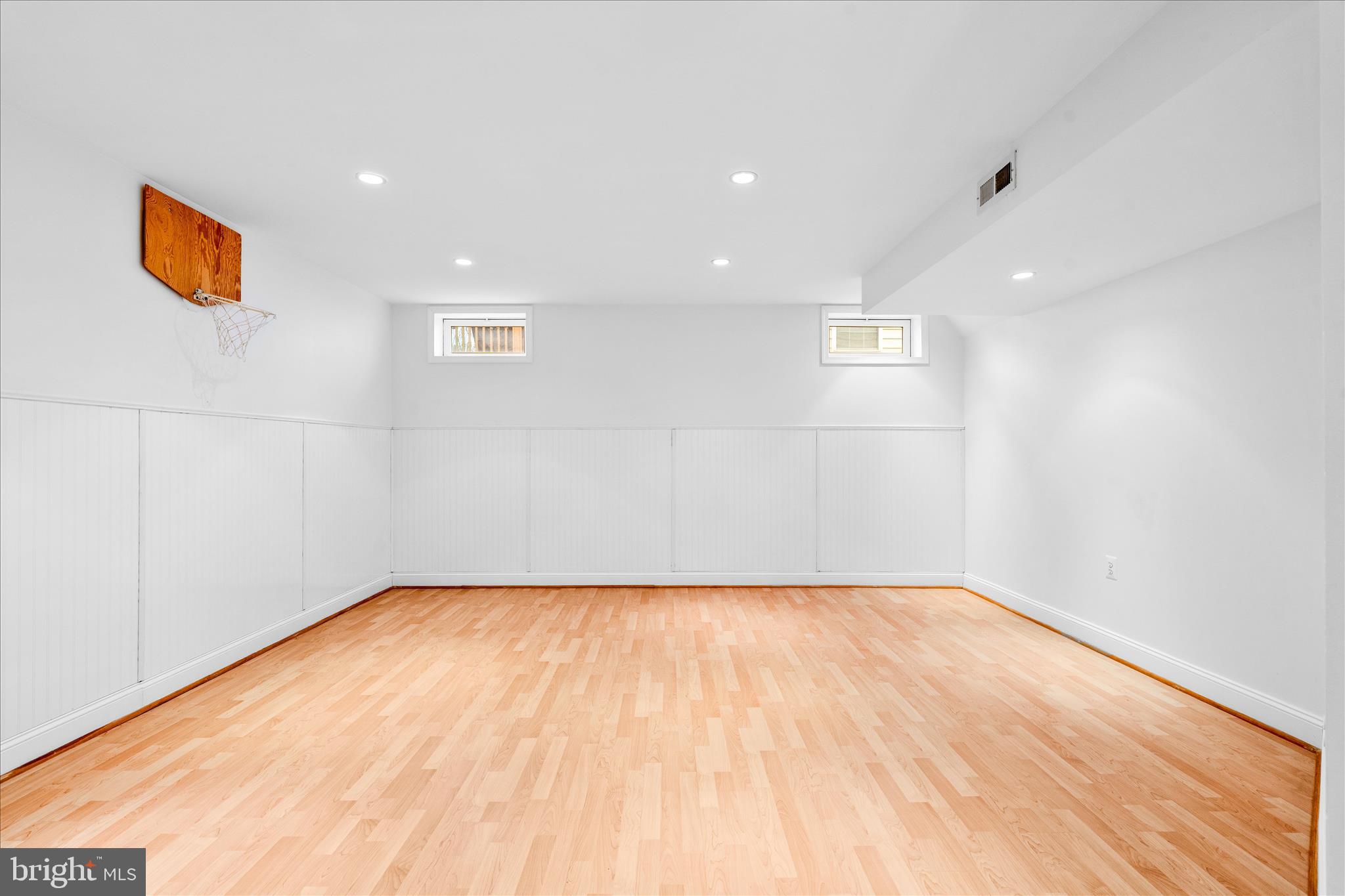 9054 Seward Street Frederick, MD 21704 - Photo 33 of 41 a view of an empty room with wooden floor and a window