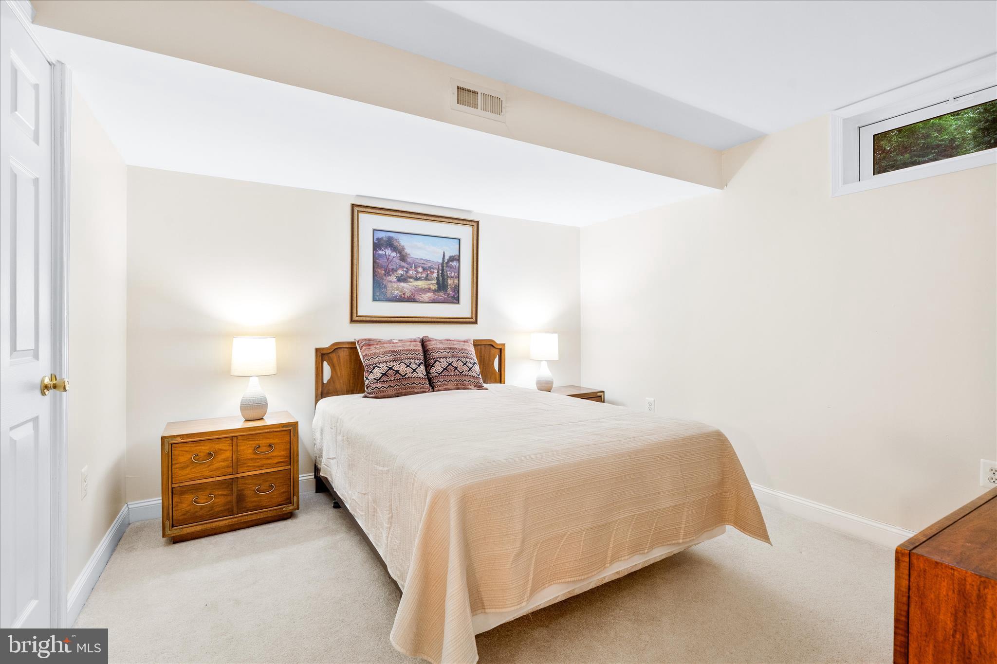 9054 Seward Street Frederick, MD 21704 - Photo 36 of 41 a bedroom with a bed and a wall painting