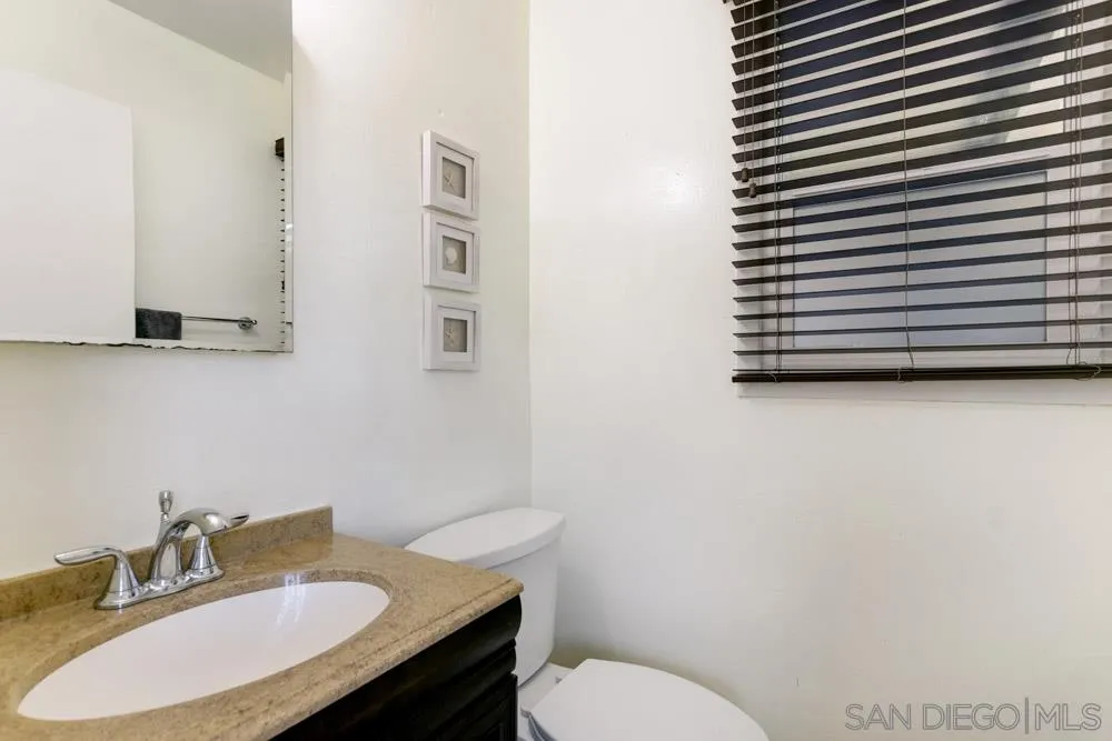 4925 Rebel Road San Diego, CA 92117 - Photo 20 of 25 a bathroom with a sink and a toilet
