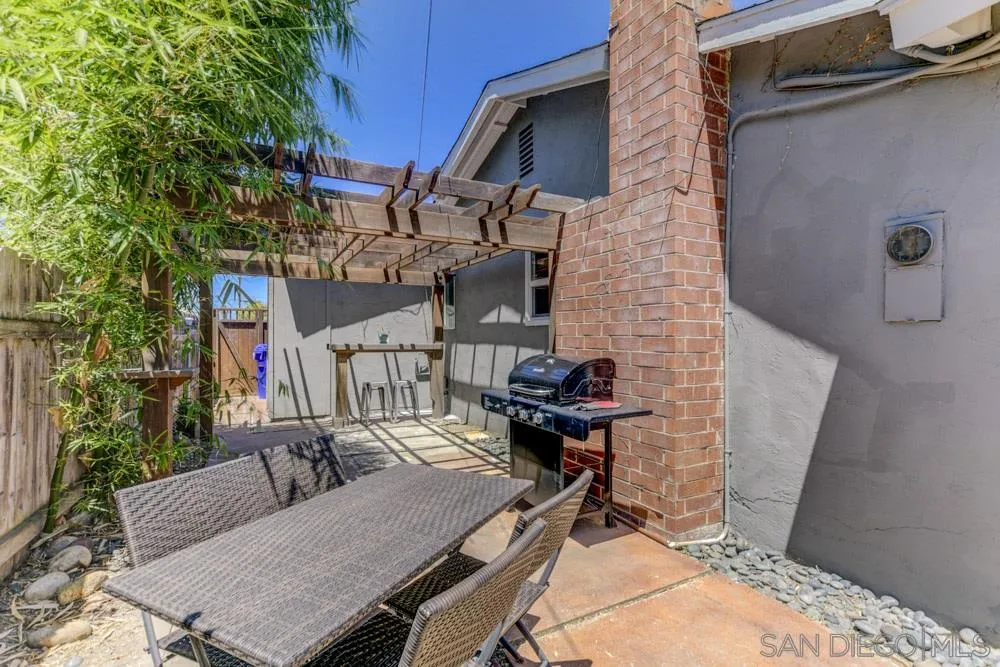 4925 Rebel Road San Diego, CA 92117 - Photo 21 of 25 a patio with table and chairs and potted plants