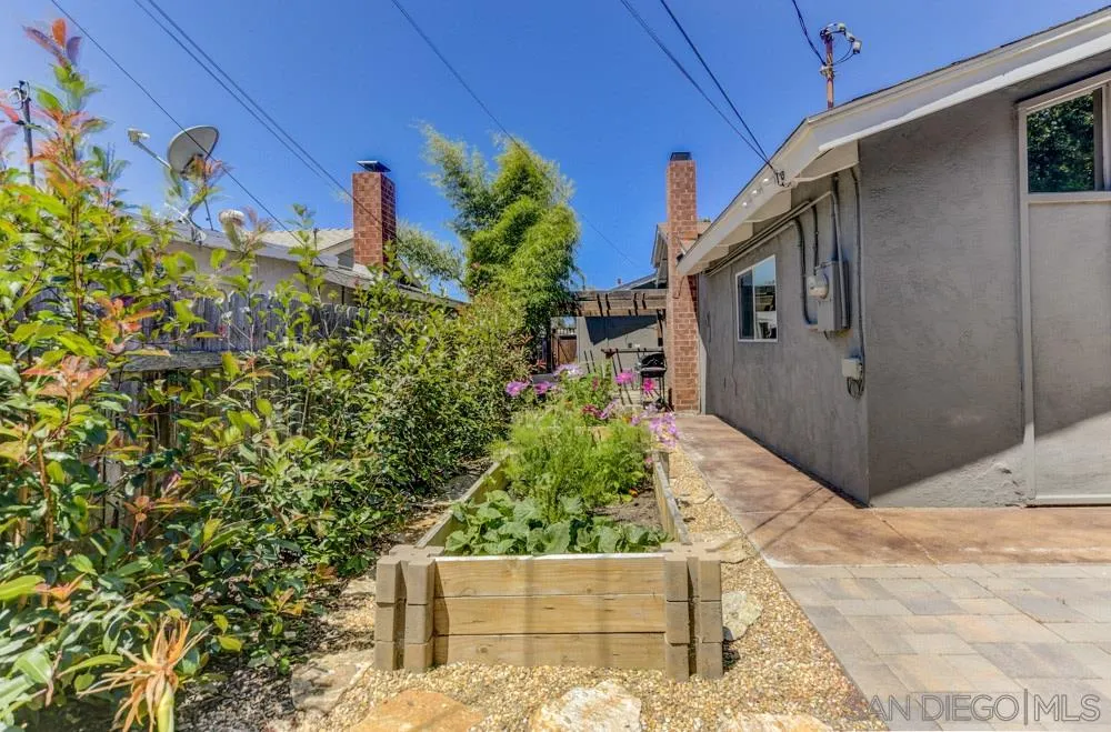 4925 Rebel Road San Diego, CA 92117 - Photo 22 of 25 a backyard of a house with lots of green space