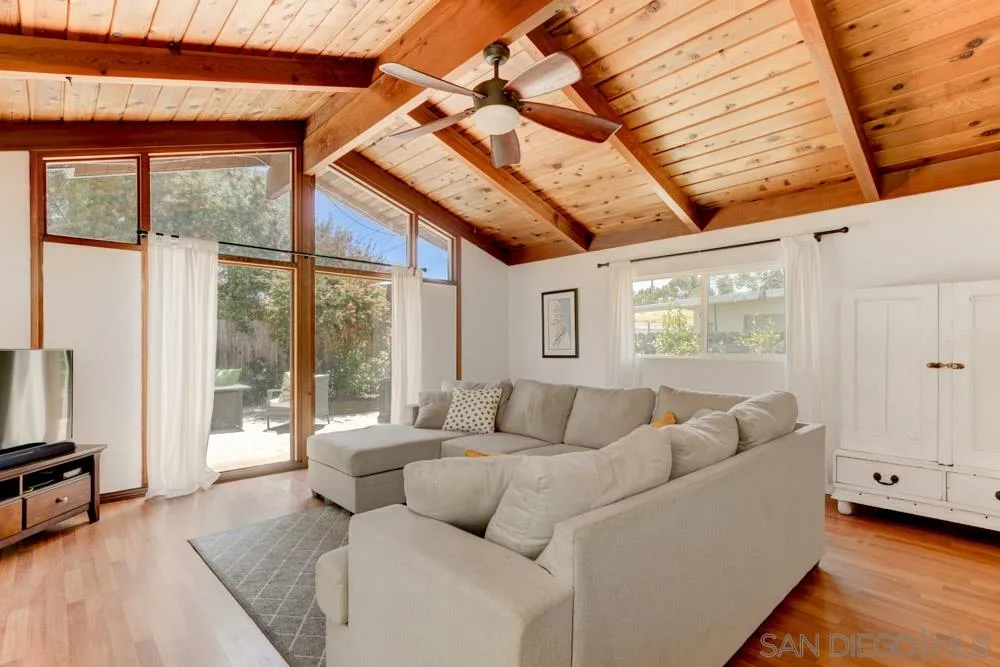 4925 Rebel Road San Diego, CA 92117 - Photo 4 of 25 a living room with furniture and a large window
