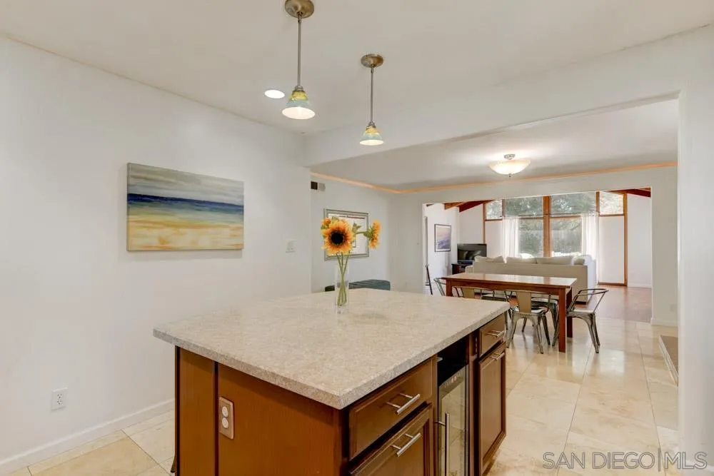 4925 Rebel Road San Diego, CA 92117 - Photo 7 of 25 a kitchen with a table and chairs in it