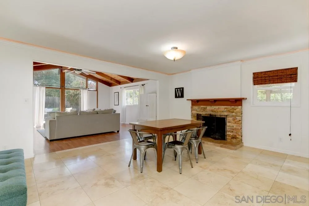 4925 Rebel Road San Diego, CA 92117 - Photo 9 of 25 a dining room with furniture and fireplace