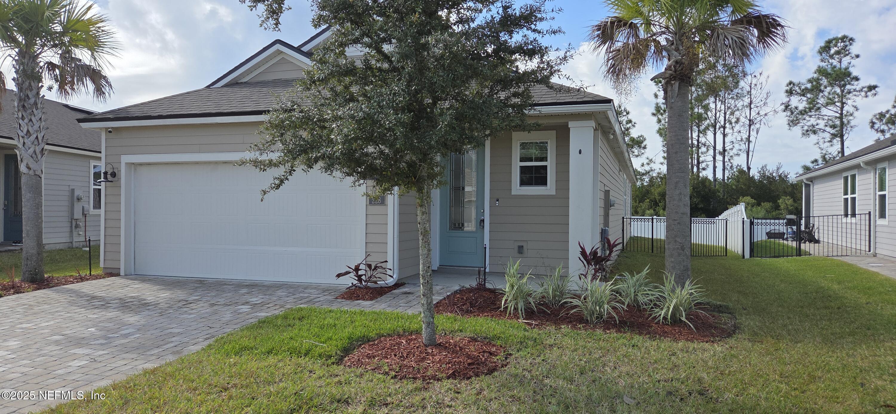 228 Thistleton Way Street St. Augustine, FL 32092 - Photo 2 of 15 a view of a house with a yard