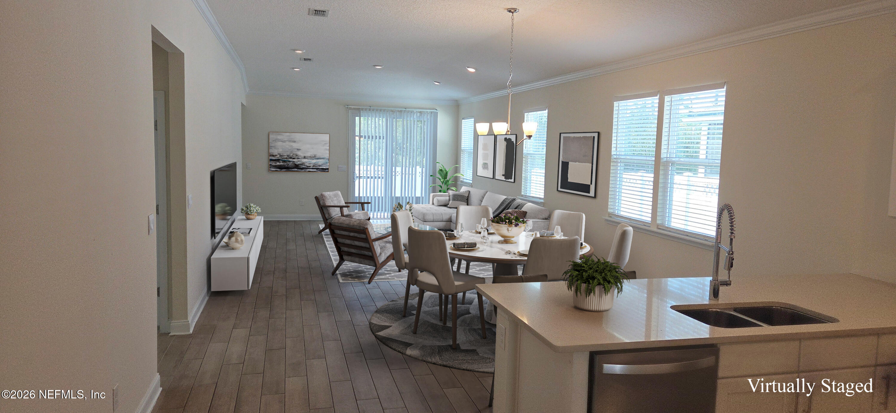 228 Thistleton Way Street St. Augustine, FL 32092 - Photo 2 of 25 a view of a dining room with furniture and wooden floor