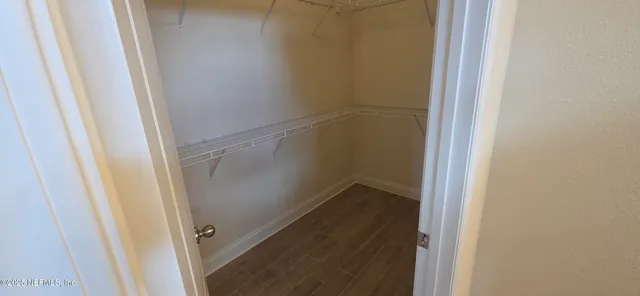 a bathroom with a shower and sink