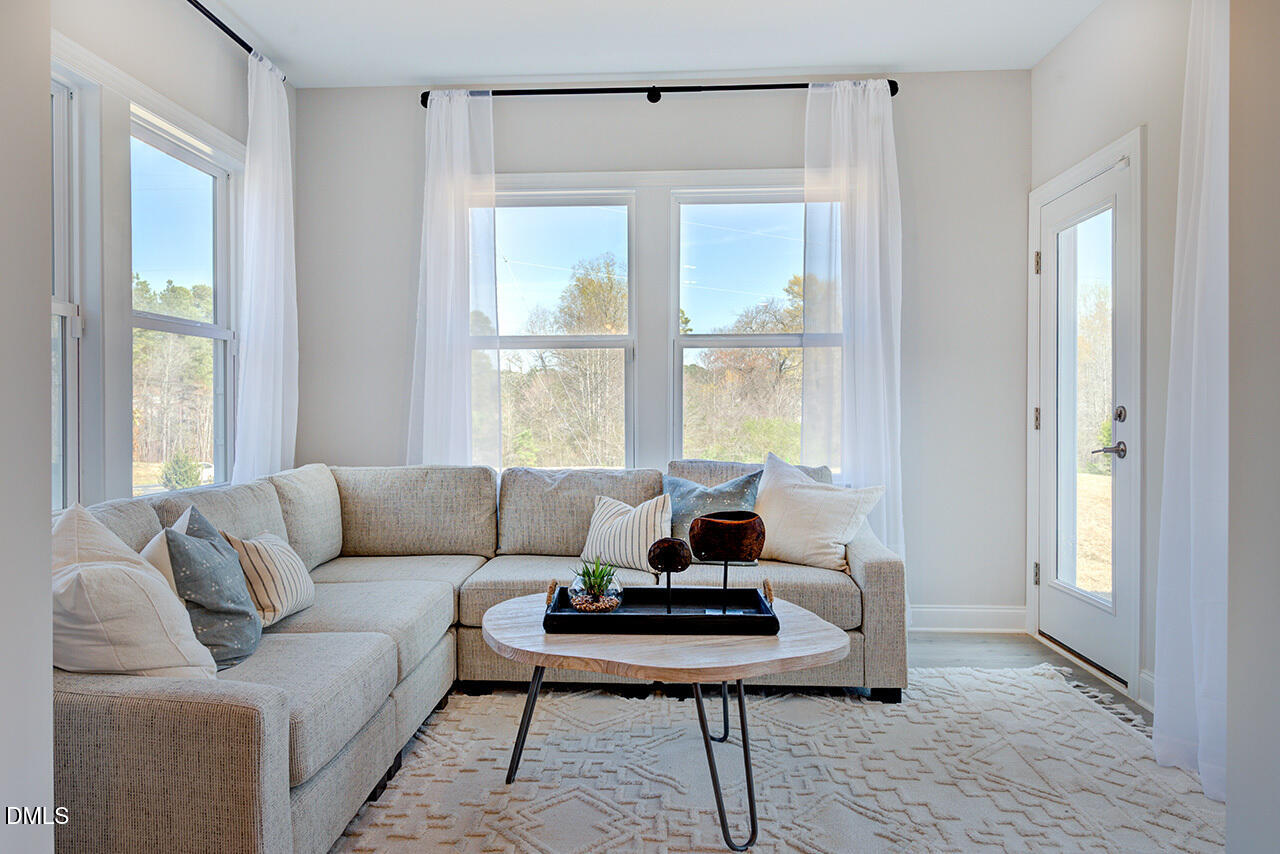 1112 Sun Spgs Road Wake Forest, NC 27587 - Photo 16 of 44 a living room with furniture and a window