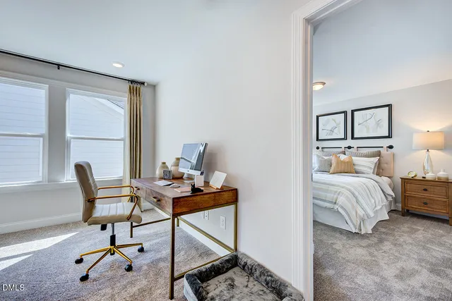 a spacious bedroom with a bed and a window