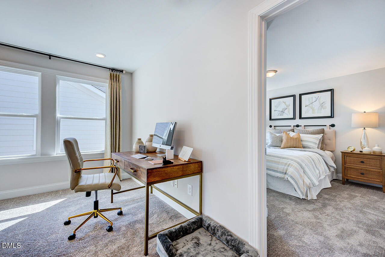 1112 Sun Spgs Road Wake Forest, NC 27587 - Photo 27 of 44 a bedroom with furniture and a window