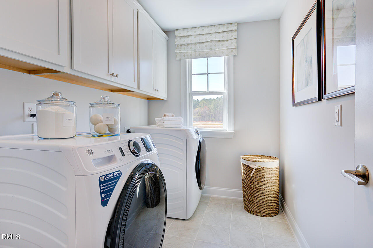 1112 Sun Spgs Road Wake Forest, NC 27587 - Photo 35 of 44 a utility room with dryer and washer