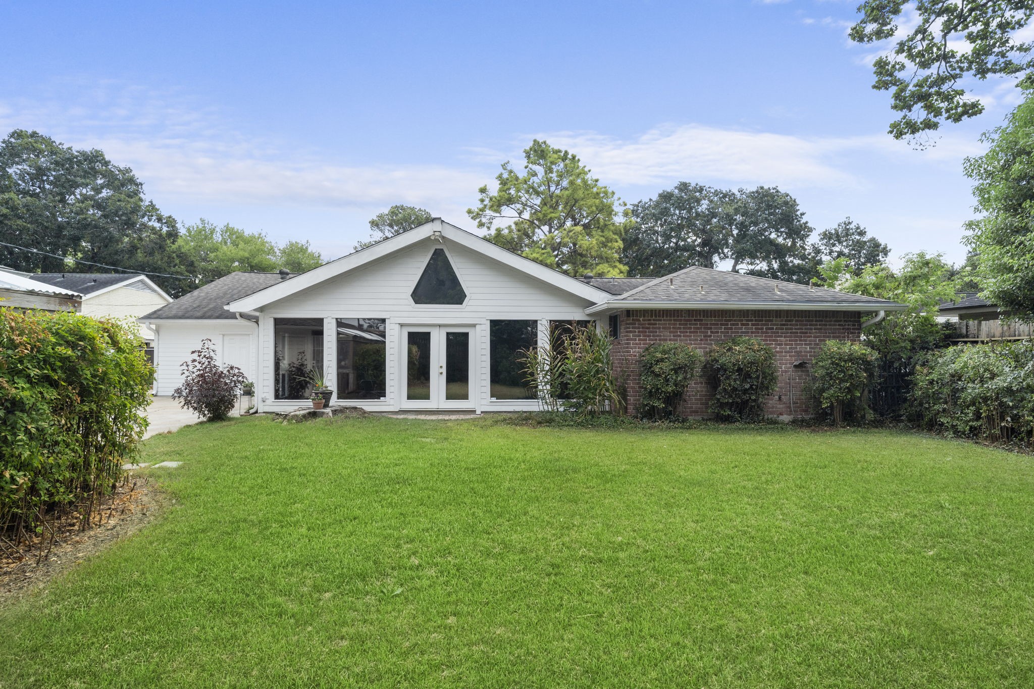 6102 Redding Road Houston, TX 77036 - Photo 4 of 40 The spacious backyard is perfect for pets and children to enjoy as-is, with plenty of room to add a pool for even more outdoor fun.