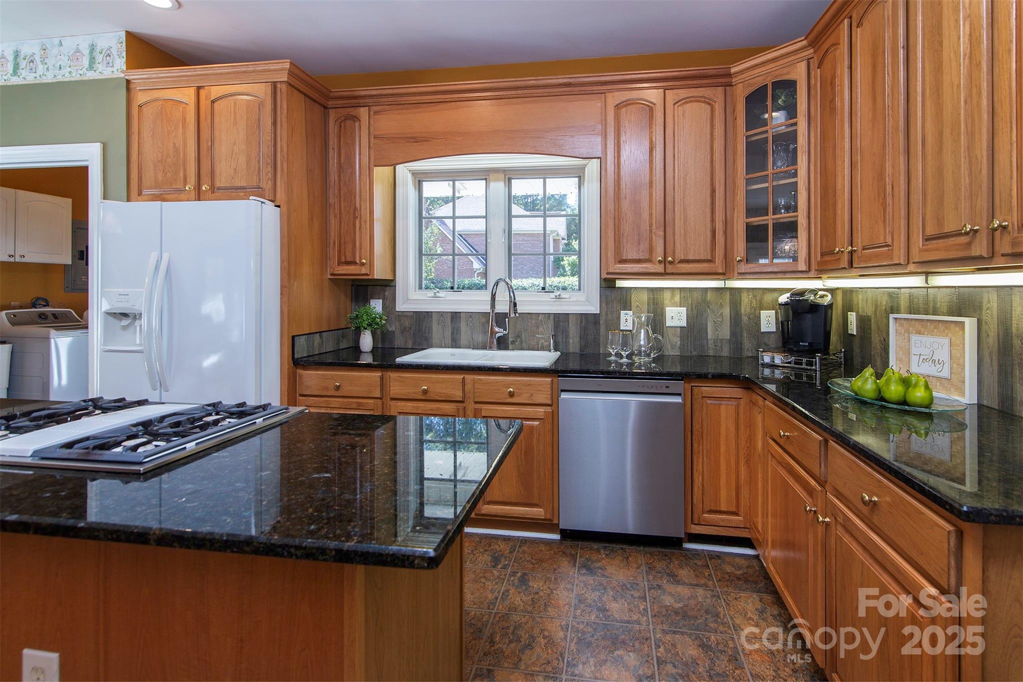 1595 High Ridge Drive Stanley, NC 28164 - Photo 13 of 32 a kitchen with stainless steel appliances granite countertop a sink a stove and a refrigerator