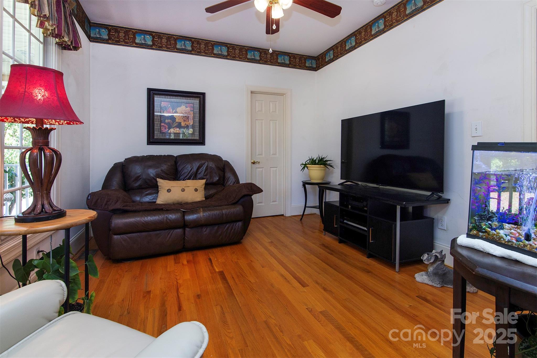 1595 High Ridge Drive Stanley, NC 28164 - Photo 16 of 32 a living room with furniture and a flat screen tv