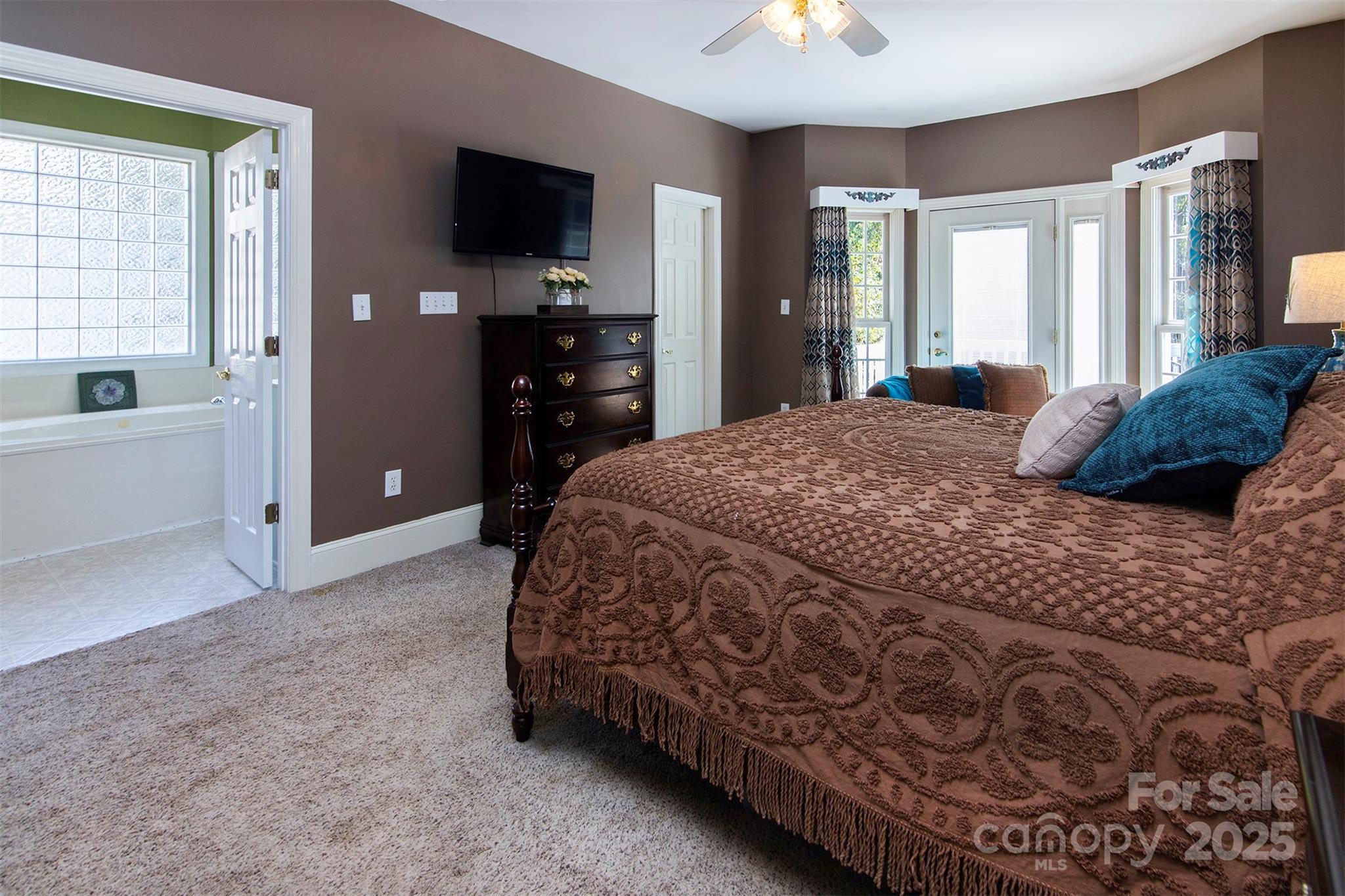 1595 High Ridge Drive Stanley, NC 28164 - Photo 19 of 32 a bedroom with a bed and a flat screen tv