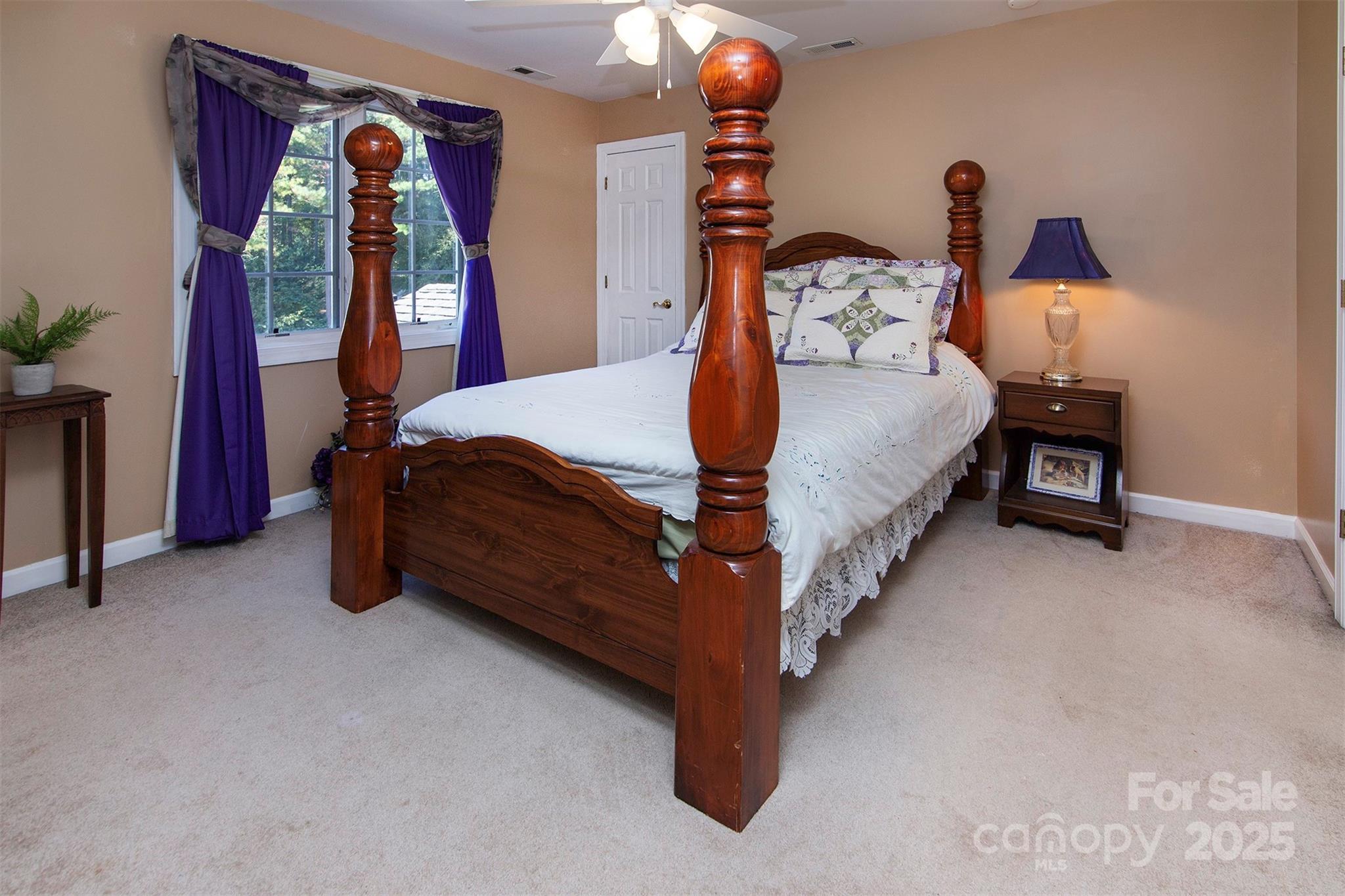 1595 High Ridge Drive Stanley, NC 28164 - Photo 22 of 32 a bed sitting in a room next to a window