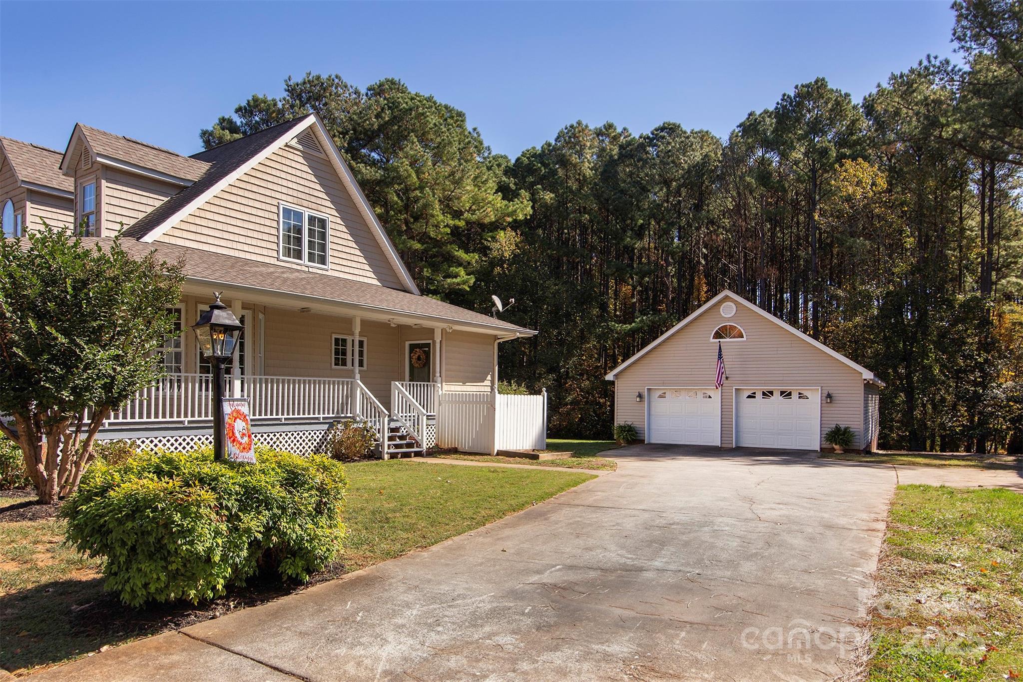 1595 High Ridge Drive Stanley, NC 28164 - Photo 27 of 32 a front view of a house with a yard and porch
