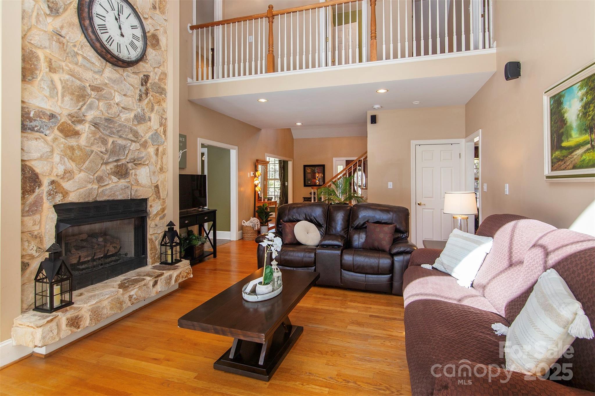 1595 High Ridge Drive Stanley, NC 28164 - Photo 6 of 32 a living room with furniture a flat screen tv and a fireplace