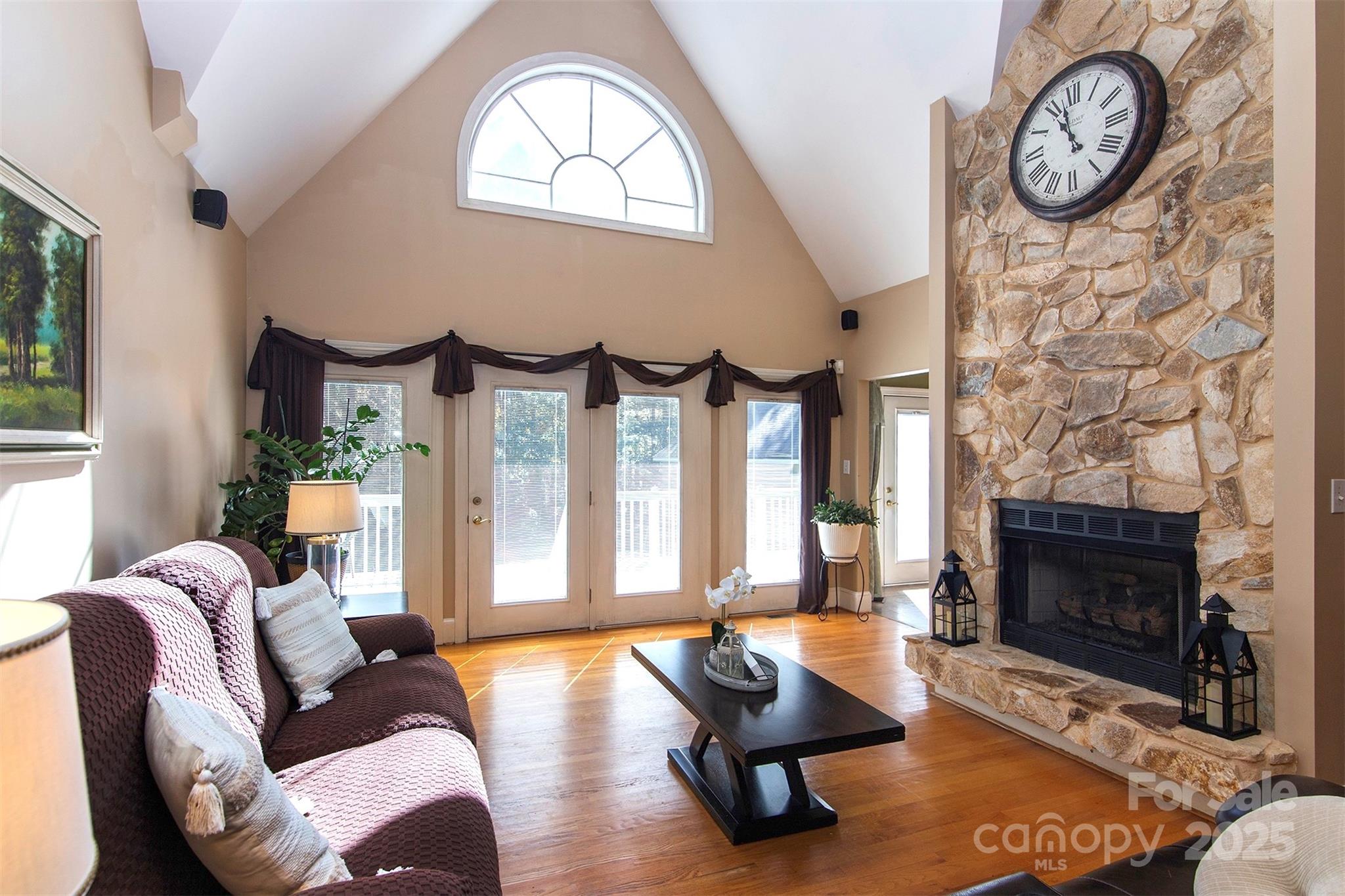 1595 High Ridge Drive Stanley, NC 28164 - Photo 7 of 32 a living room with furniture a fireplace and a large window