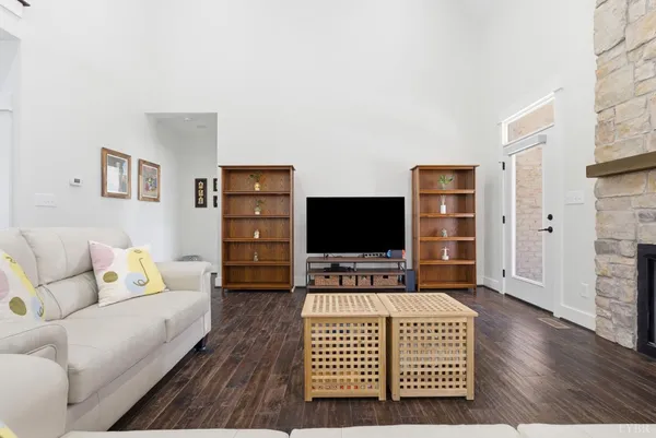 a dining room with furniture and a book shelf