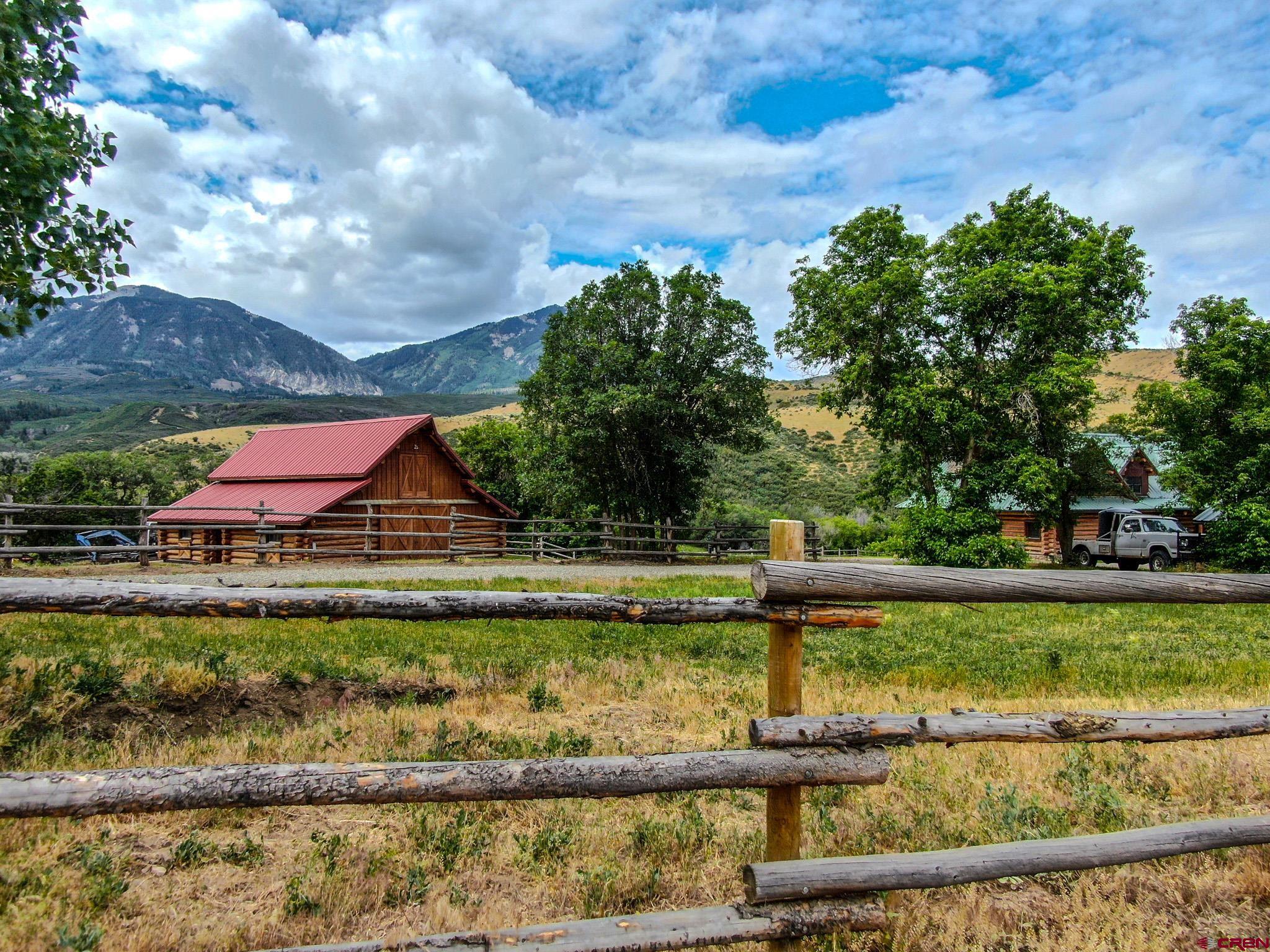 6300 Minnesota Creek Road Somerset, CO 81428 - Photo 15 of 22 a view of a lake with a house in the background