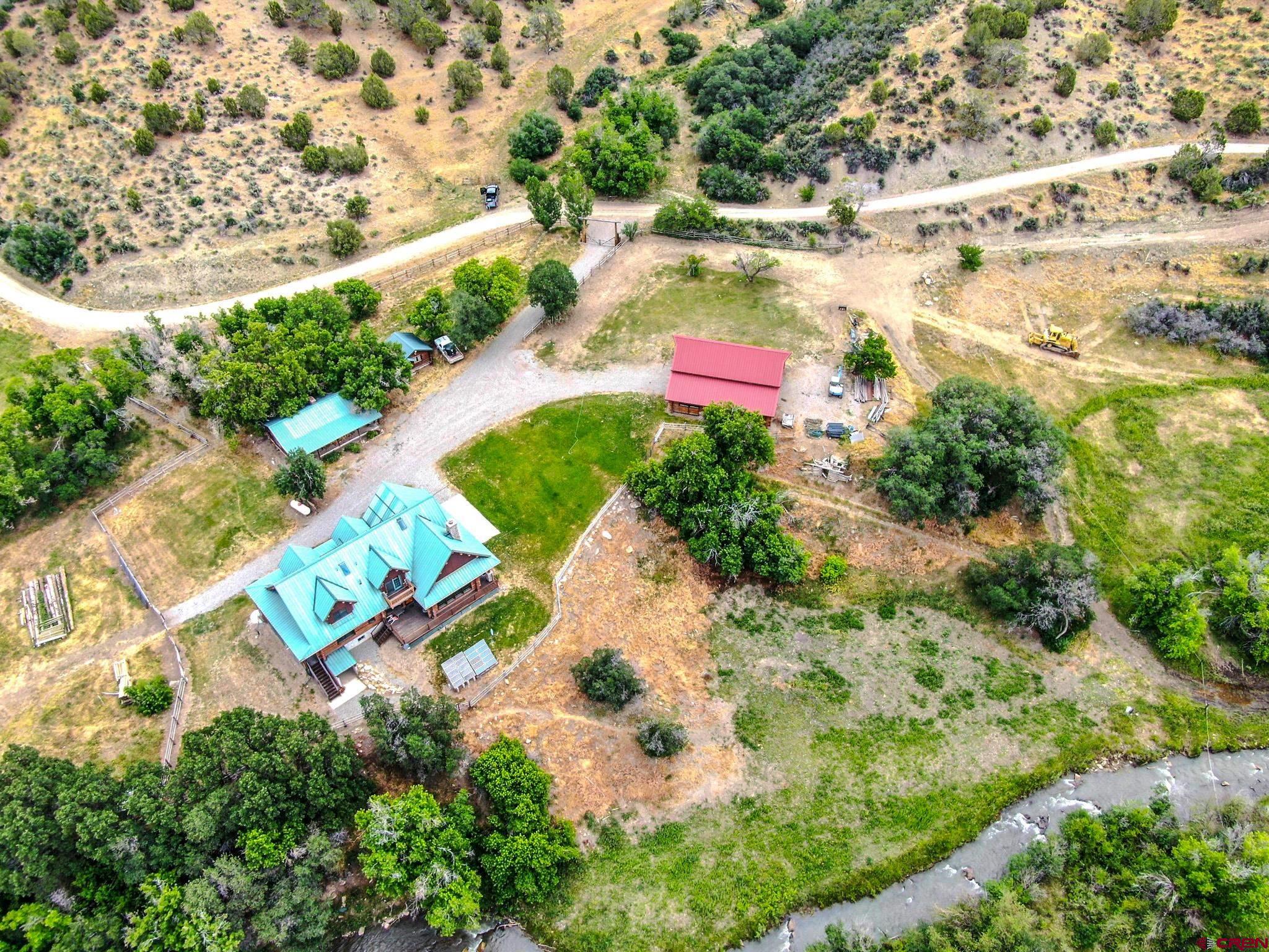 6300 Minnesota Creek Road Somerset, CO 81428 - Photo 20 of 22 an aerial view of a house with a yard
