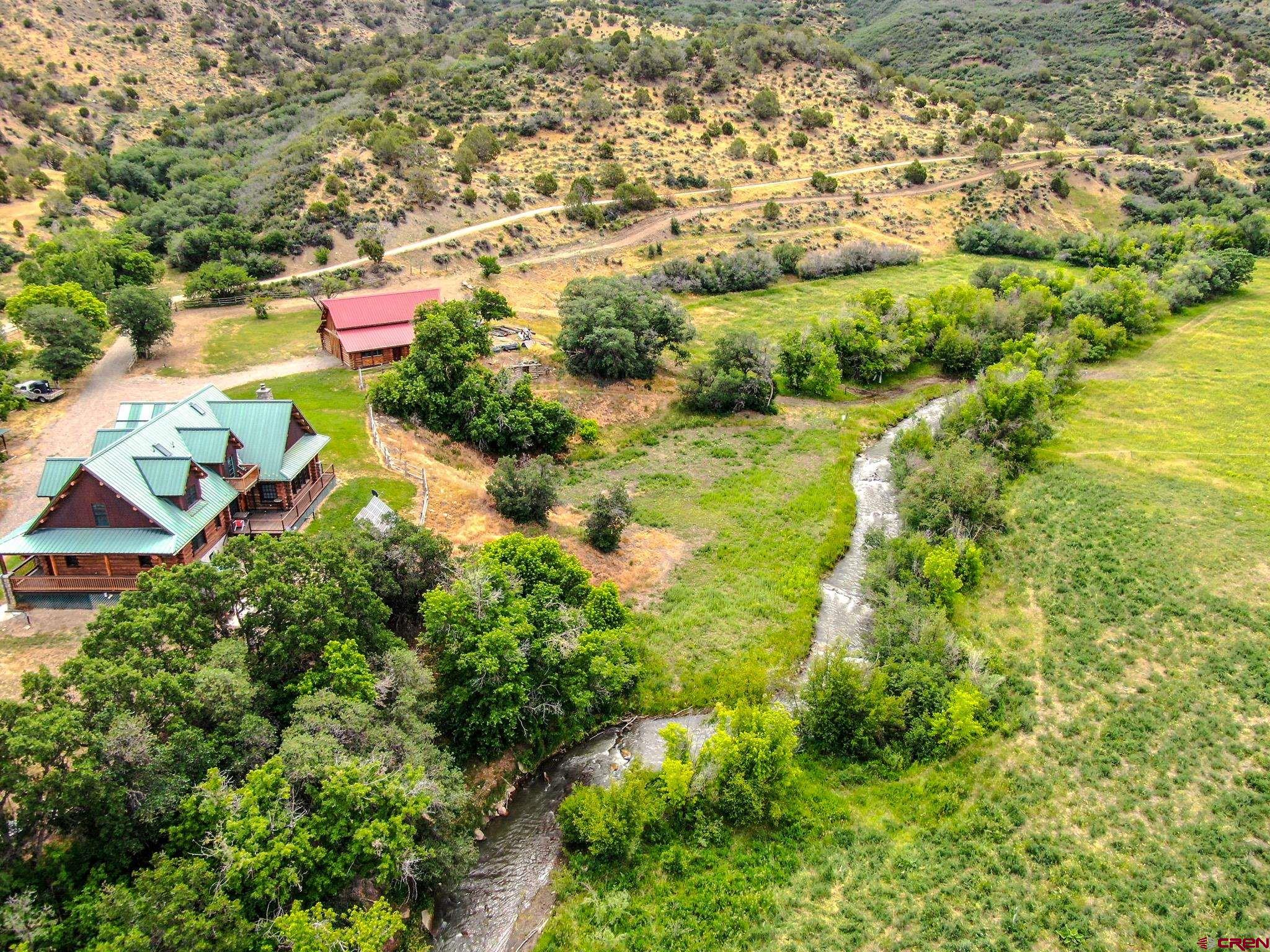 6300 Minnesota Creek Road Somerset, CO 81428 - Photo 8 of 22 an aerial view of residential houses with outdoor space and trees