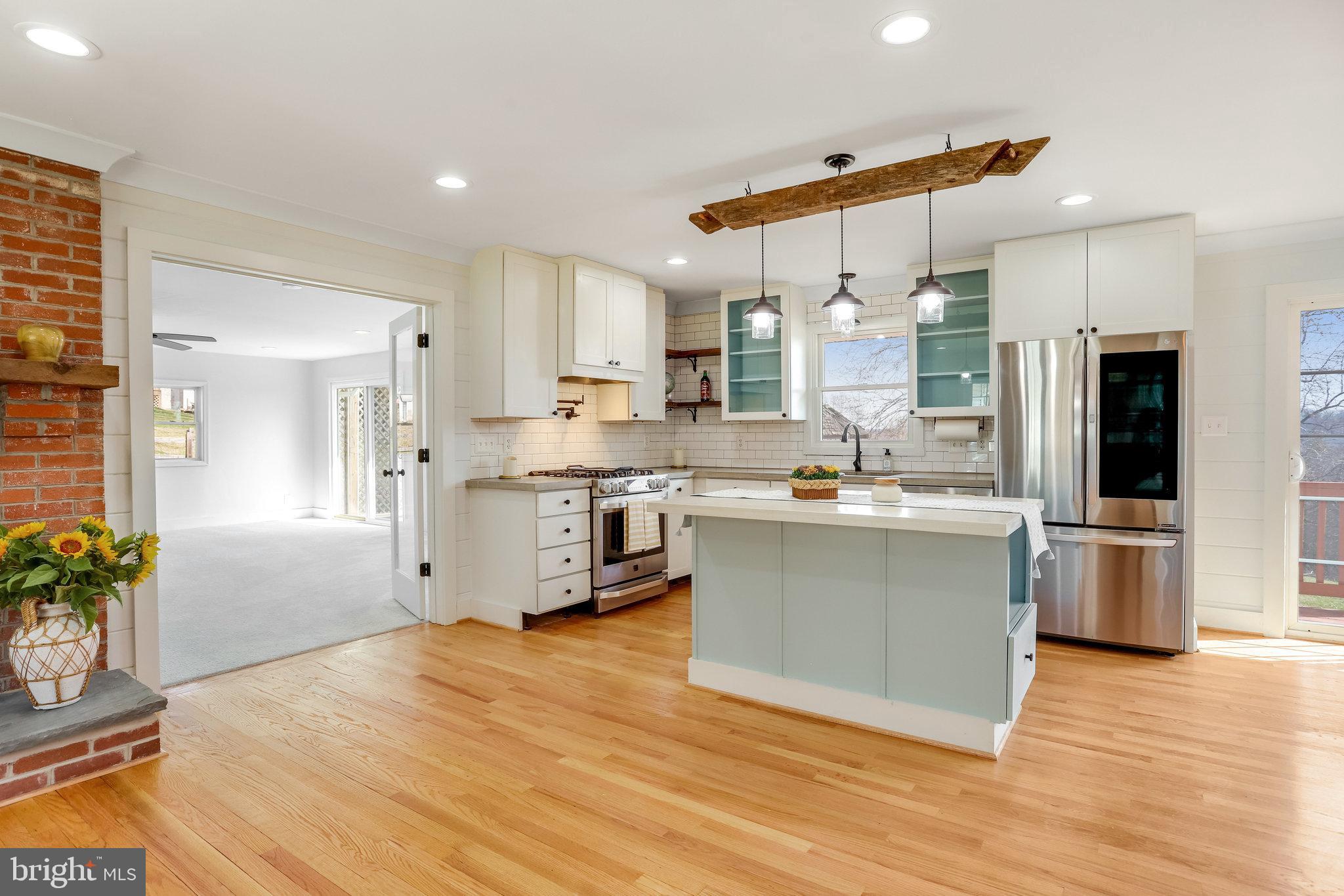 6343 Yeagertown Road New Market, MD 21774 - Photo 17 of 58 a large kitchen with cabinets and stainless steel appliances