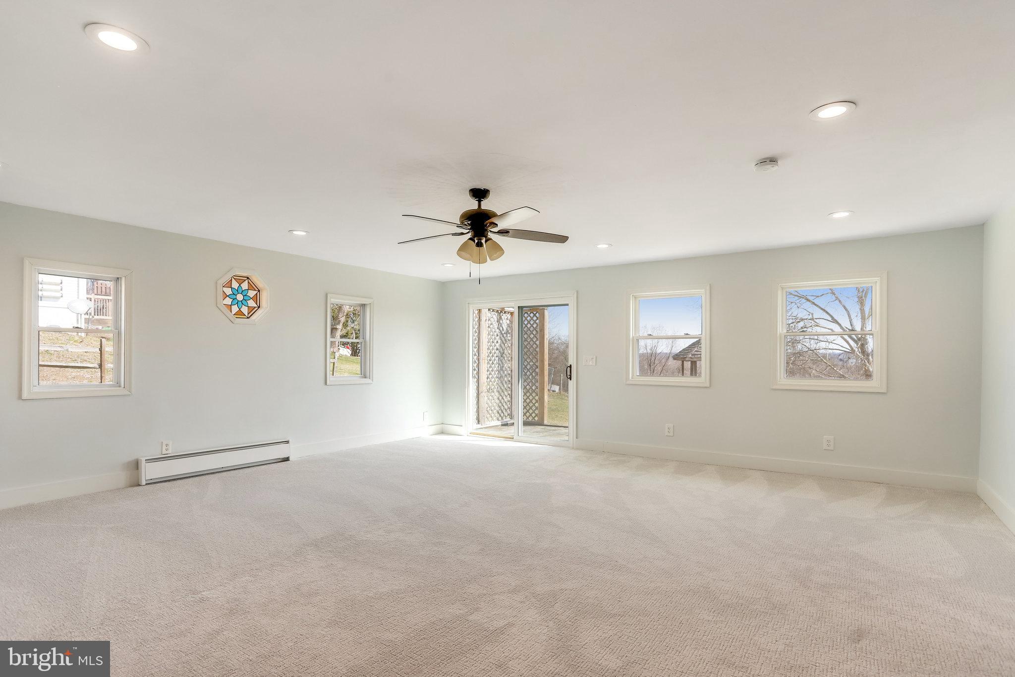 6343 Yeagertown Road New Market, MD 21774 - Photo 22 of 58 a view of a livingroom with a ceiling fan and window