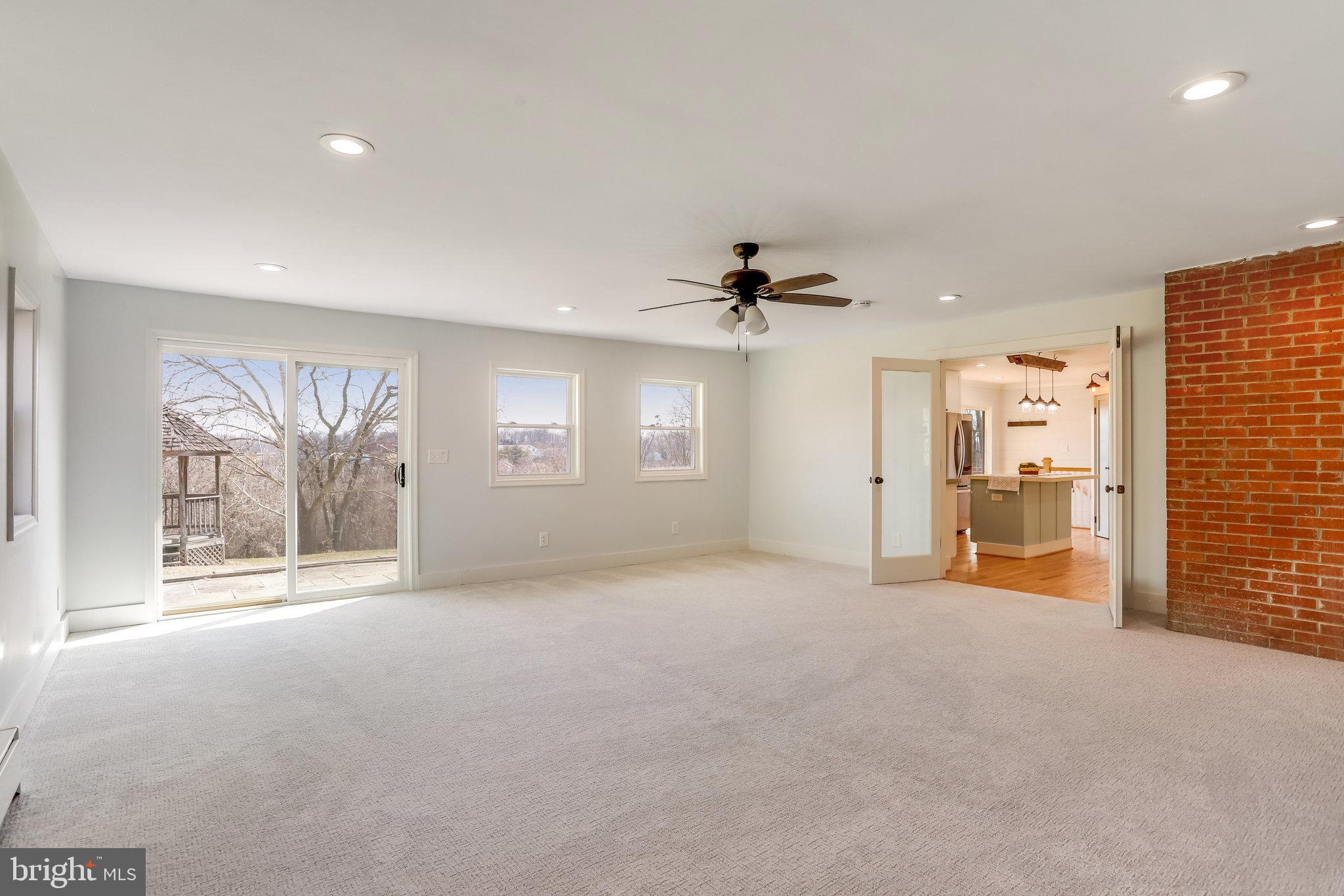 6343 Yeagertown Road New Market, MD 21774 - Photo 25 of 58 a view of a livingroom with a ceiling fan and window