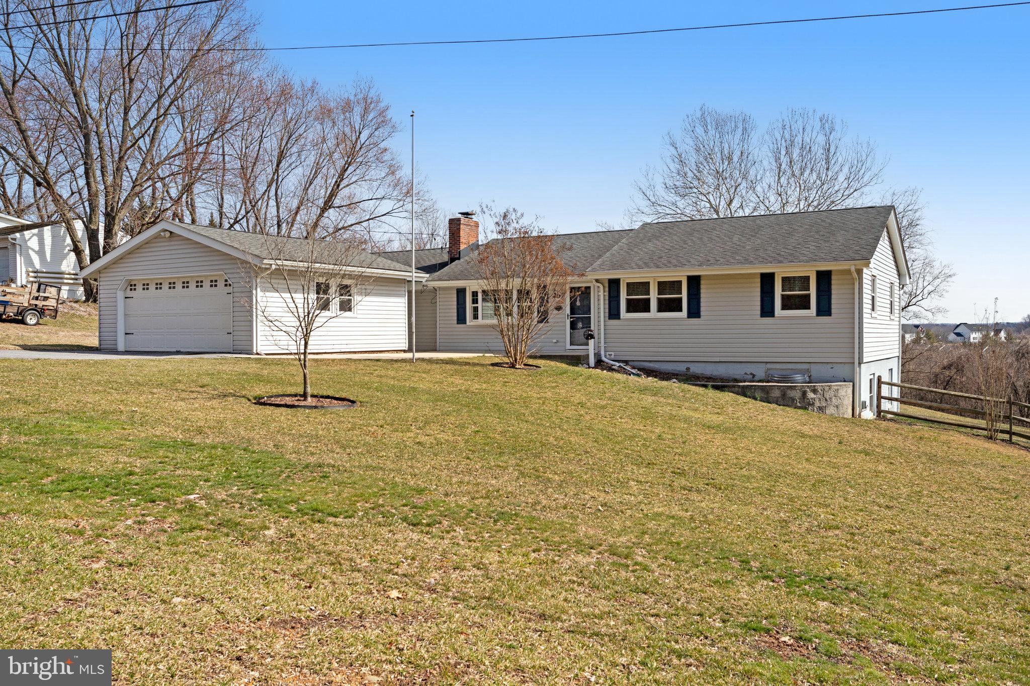 6343 Yeagertown Road New Market, MD 21774 - Photo 3 of 58 a front view of a house with a yard