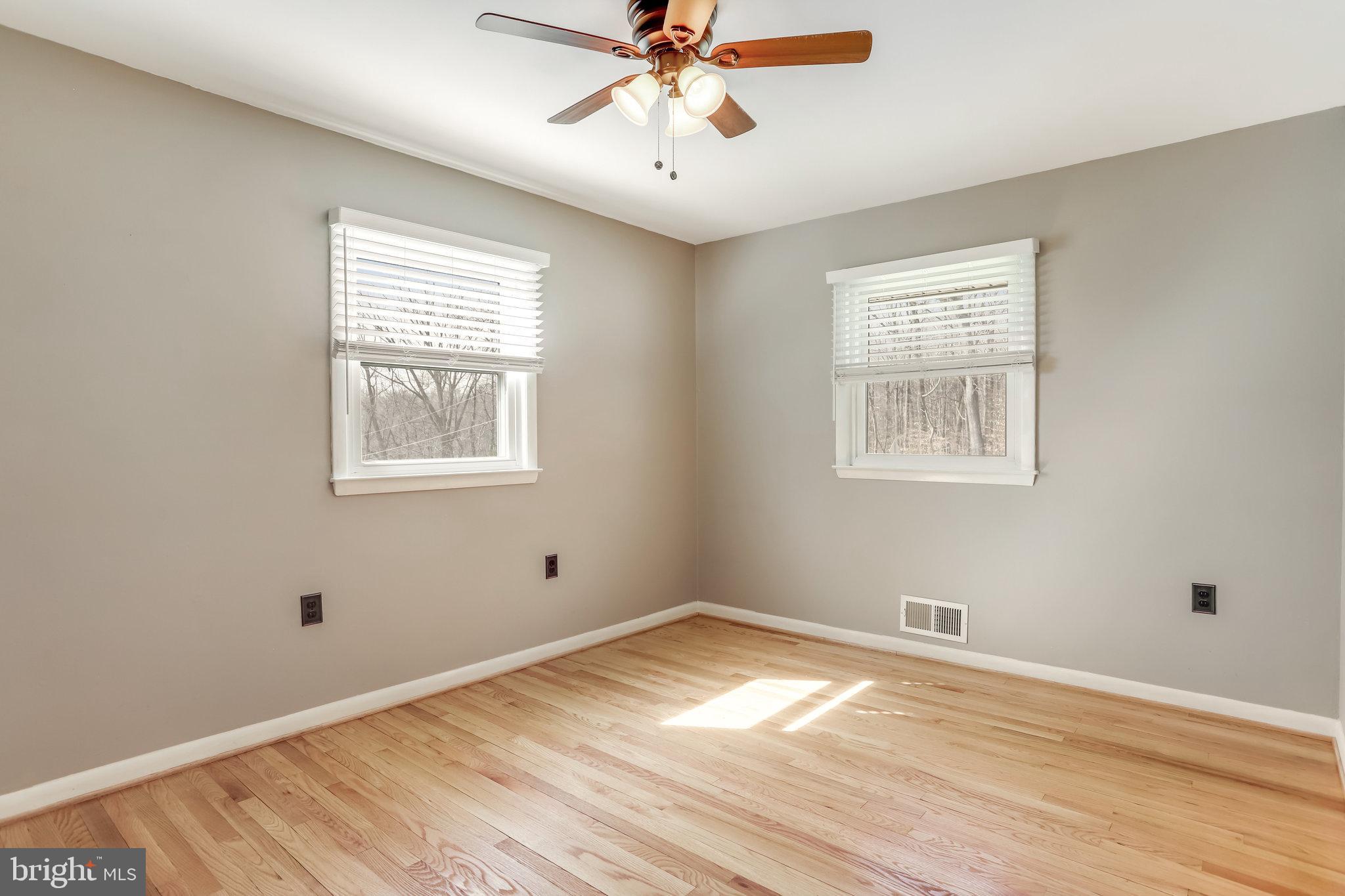 6343 Yeagertown Road New Market, MD 21774 - Photo 32 of 58 a view of empty room with wooden floor and fan