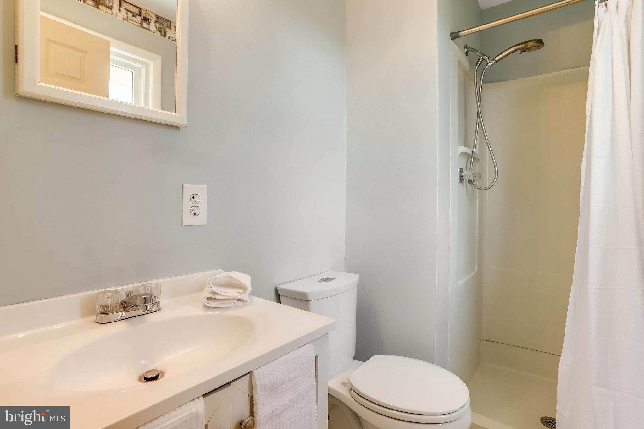 6343 Yeagertown Road New Market, MD 21774 - Photo 36 of 58 a bathroom with a sink toilet and shower
