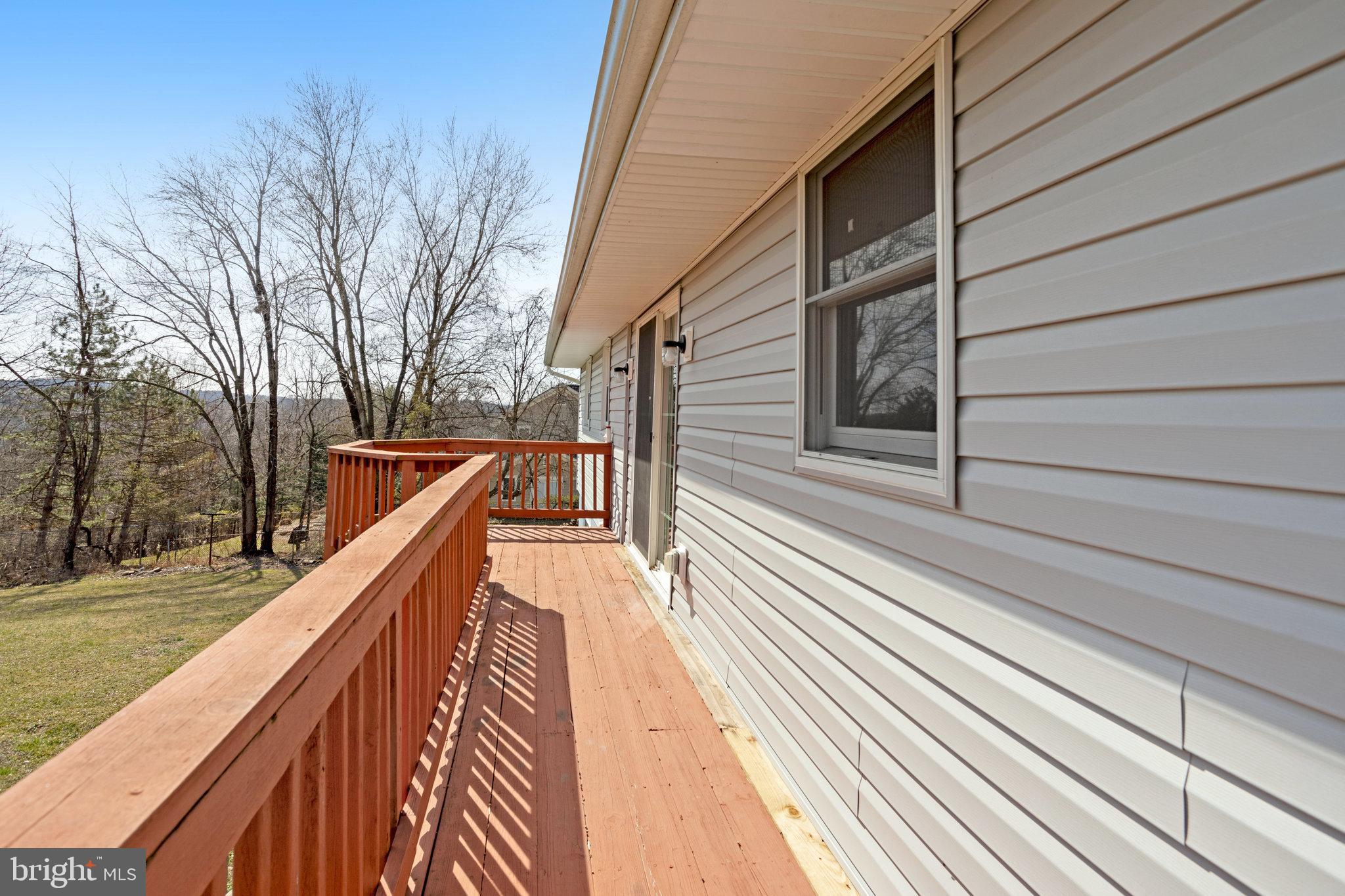 6343 Yeagertown Road New Market, MD 21774 - Photo 47 of 58 a view of balcony with wooden floor and fence and a potted plant
