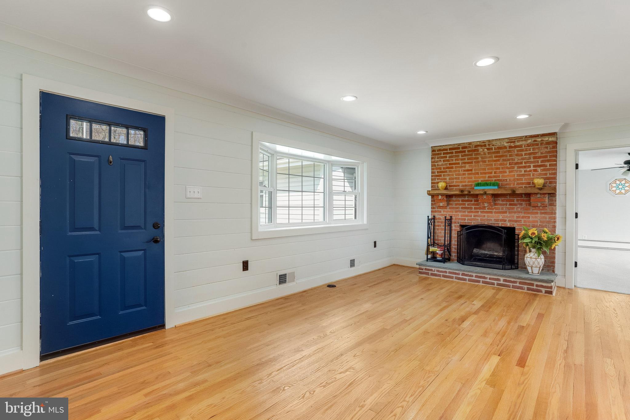 6343 Yeagertown Road New Market, MD 21774 - Photo 10 of 58 a view of an empty room with a fireplace and a window