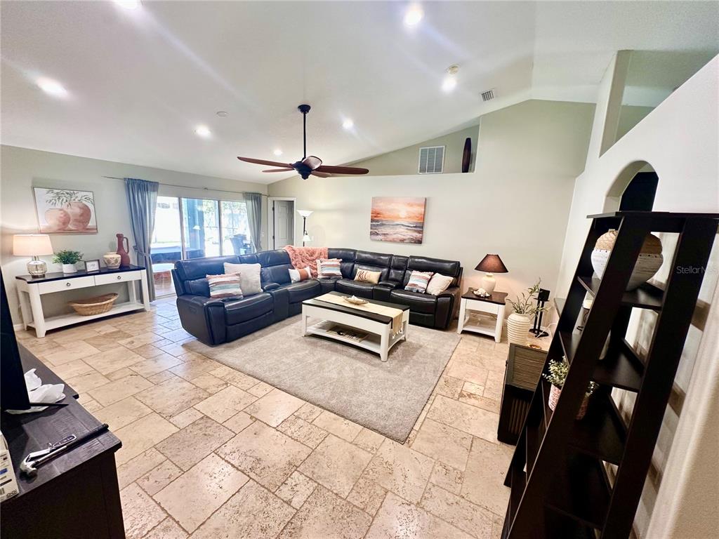 7 Lancaster Lane Palm Coast, FL 32137 - Photo 15 of 67 a living room with furniture and a fireplace