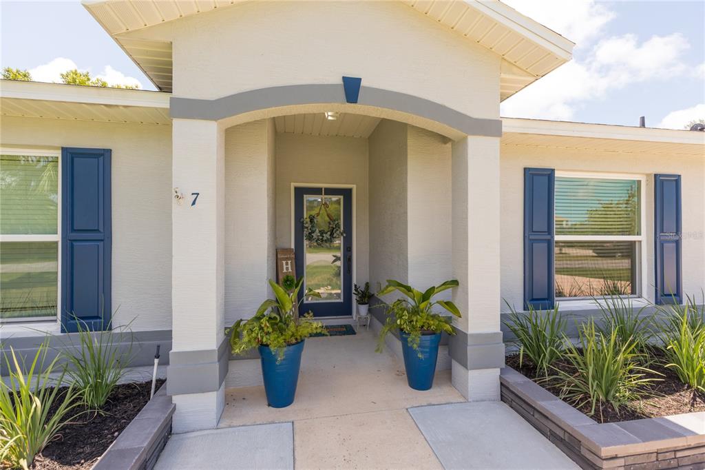 7 Lancaster Lane Palm Coast, FL 32137 - Photo 16 of 67 a front view of a house having patio
