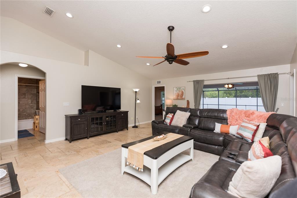 7 Lancaster Lane Palm Coast, FL 32137 - Photo 26 of 67 a living room with furniture and a flat screen tv