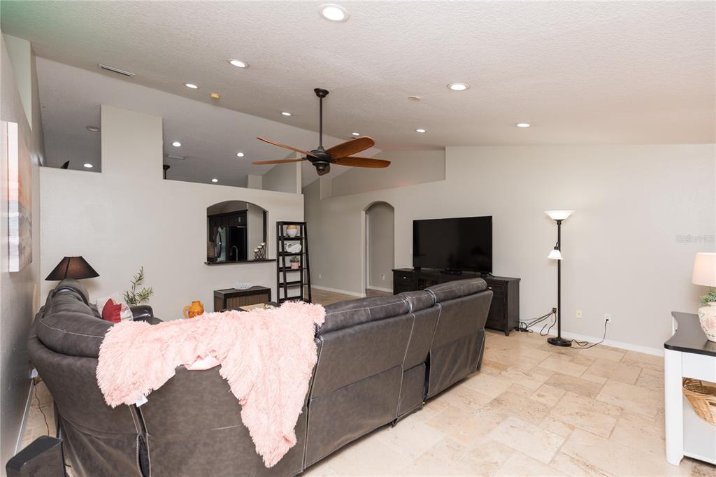 7 Lancaster Lane Palm Coast, FL 32137 - Photo 27 of 67 a living room with furniture and a flat screen tv